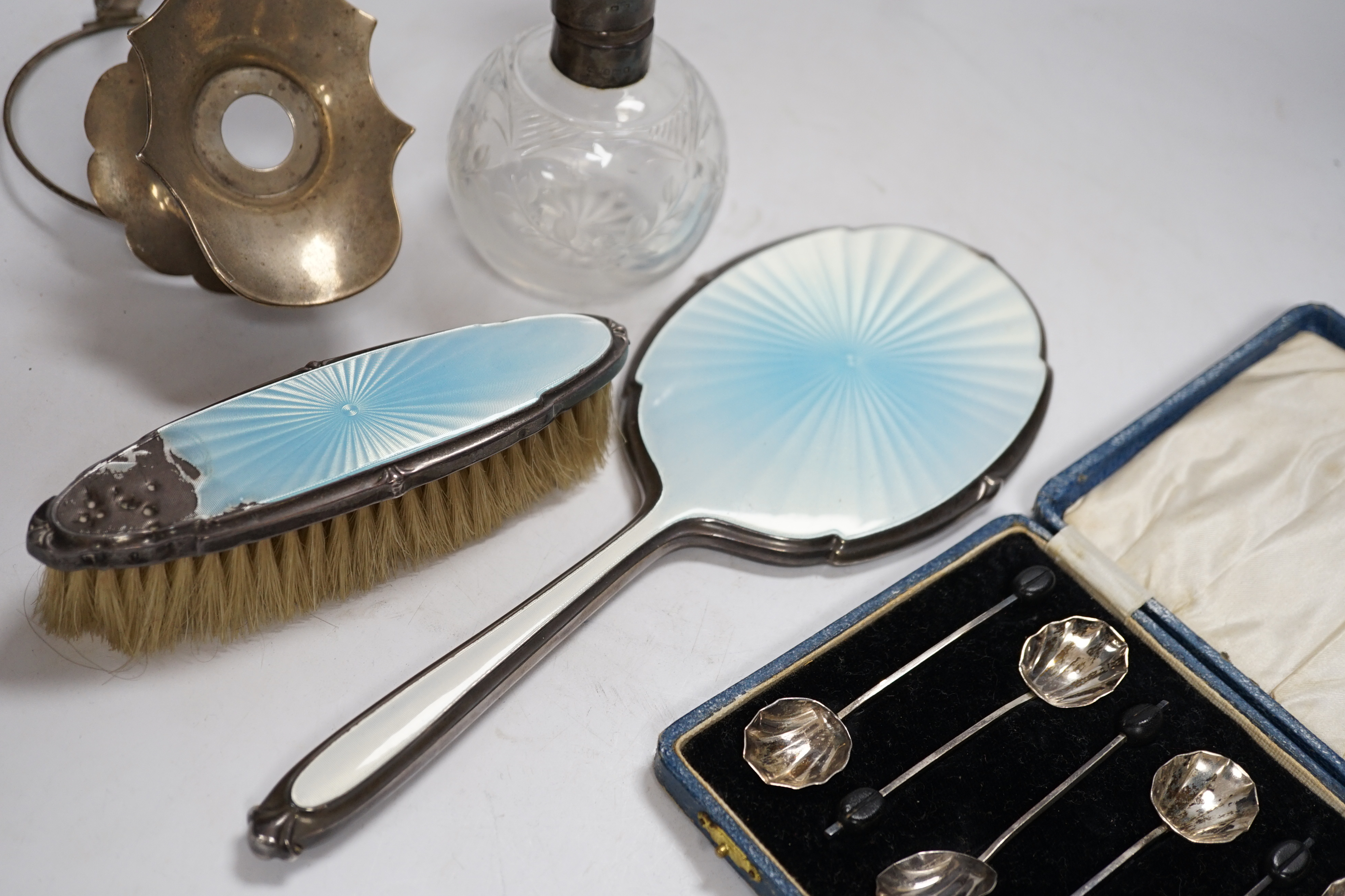 A George V silver claret jug mount, Walker & Hall, Sheffield, 1912, three silver and enamel dressing table items including a hand mirror and a cased set of six silver bean end coffee spoons.